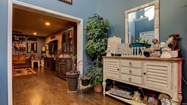 hall with dark hardwood / wood-style floors