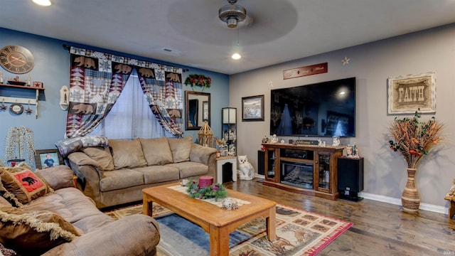 living room with hardwood / wood-style floors and ceiling fan