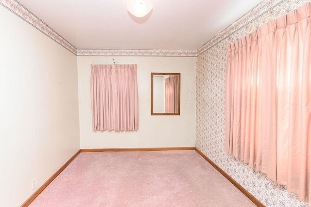 unfurnished room with carpet floors and ornamental molding