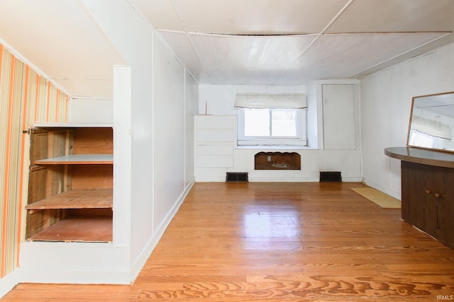 unfurnished living room with light hardwood / wood-style flooring