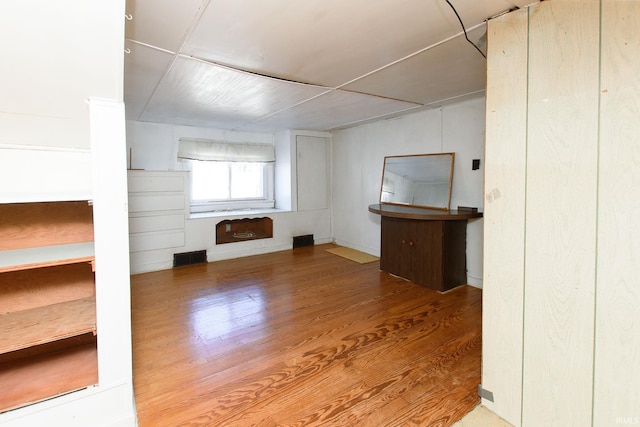 unfurnished living room with hardwood / wood-style floors