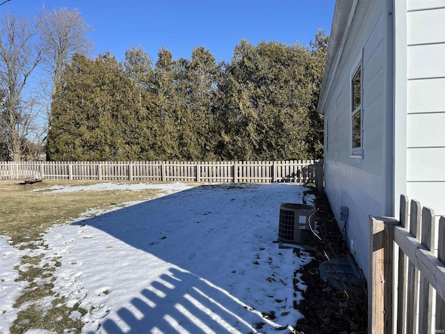 snowy yard with central air condition unit