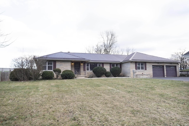 ranch-style home with a garage and a front lawn