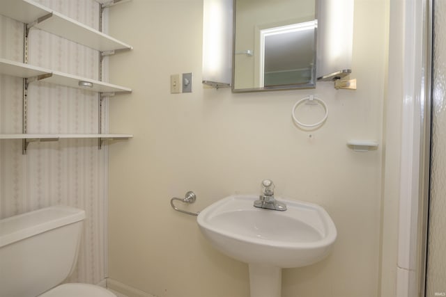 bathroom with toilet and sink