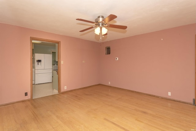 spare room with ceiling fan and light hardwood / wood-style floors