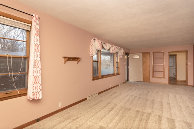 empty room featuring carpet flooring