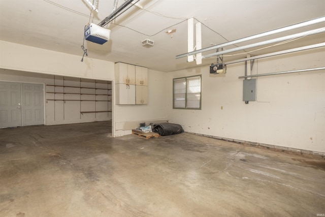 garage featuring a garage door opener and electric panel