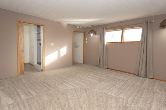 empty room with light colored carpet