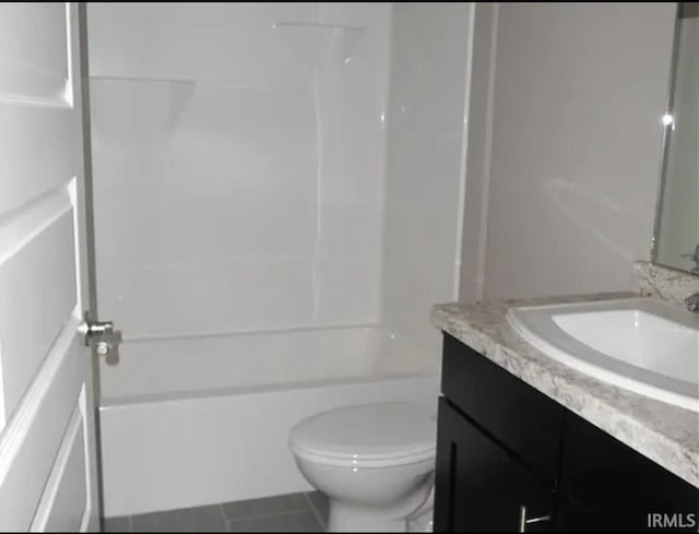 full bathroom featuring vanity, tile patterned flooring, shower / bathtub combination, and toilet