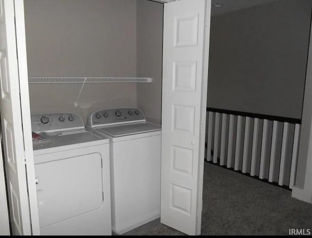 clothes washing area featuring washing machine and clothes dryer