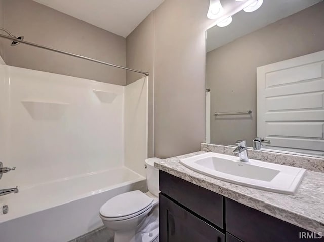 full bathroom featuring shower / tub combination, vanity, and toilet