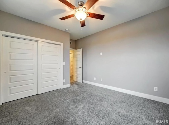 unfurnished bedroom featuring ceiling fan, carpet floors, and a closet