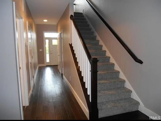 stairway featuring hardwood / wood-style flooring