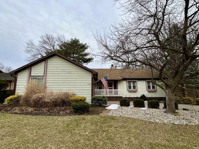 view of side of home featuring a lawn