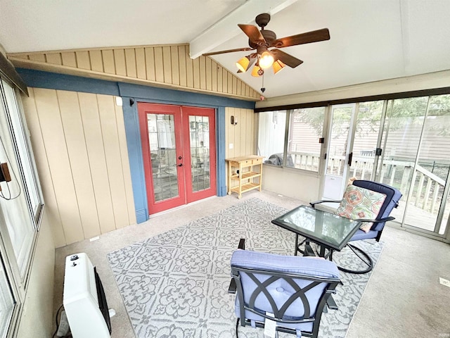 sunroom / solarium featuring lofted ceiling with beams, french doors, and ceiling fan