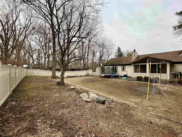 view of yard with a trampoline