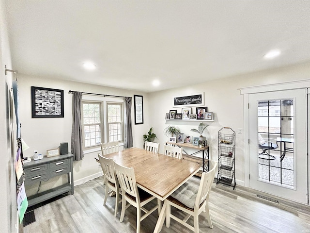 dining area with light wood-type flooring