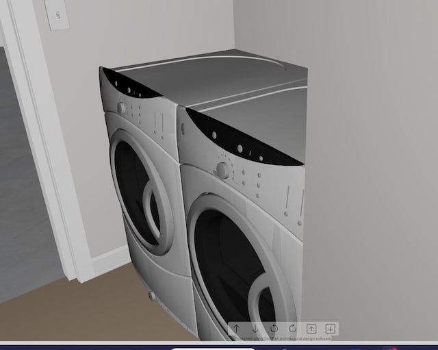 clothes washing area featuring washing machine and clothes dryer