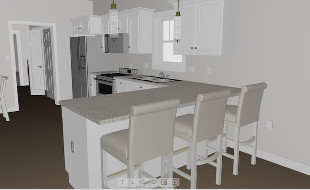 kitchen featuring pendant lighting, white cabinetry, sink, a breakfast bar area, and gas range