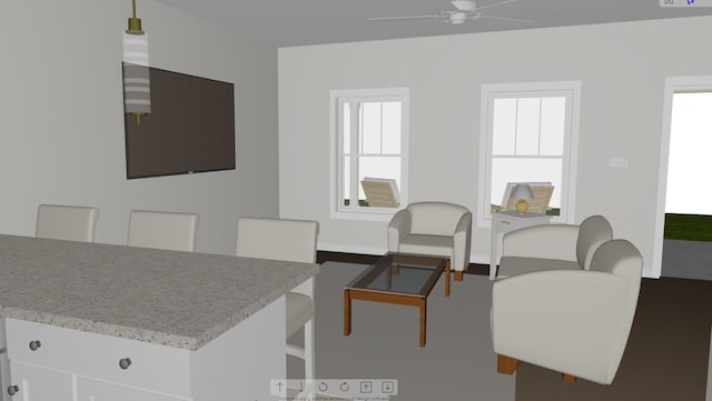 dining room with dark wood-type flooring and ceiling fan