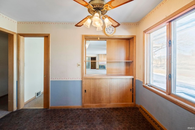 unfurnished dining area featuring ceiling fan