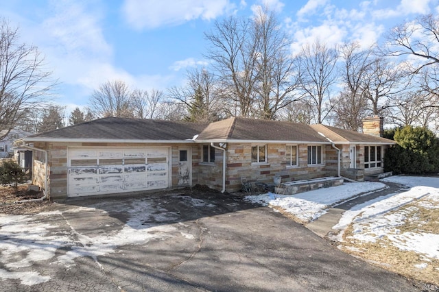 single story home featuring a garage