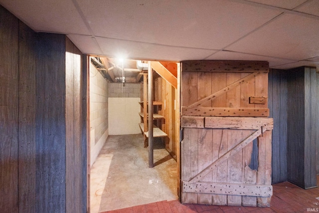 basement featuring a drop ceiling