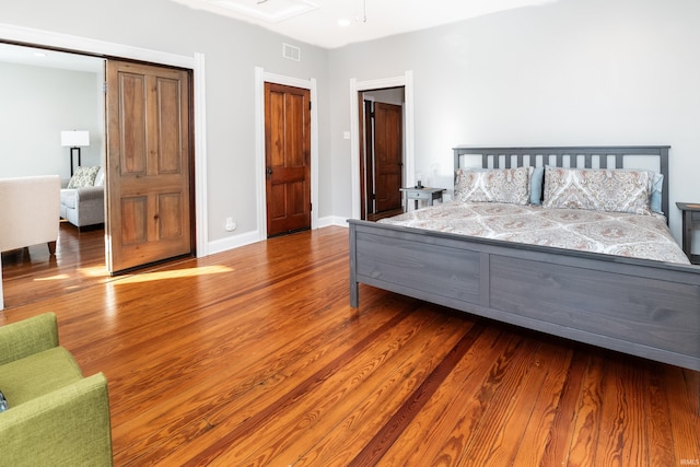 bedroom with hardwood / wood-style floors