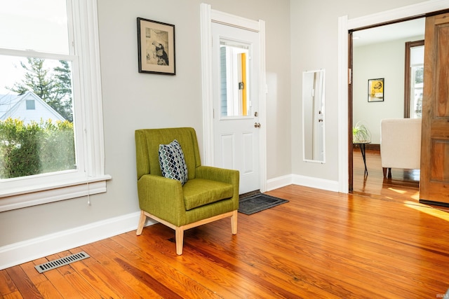 sitting room with light hardwood / wood-style floors