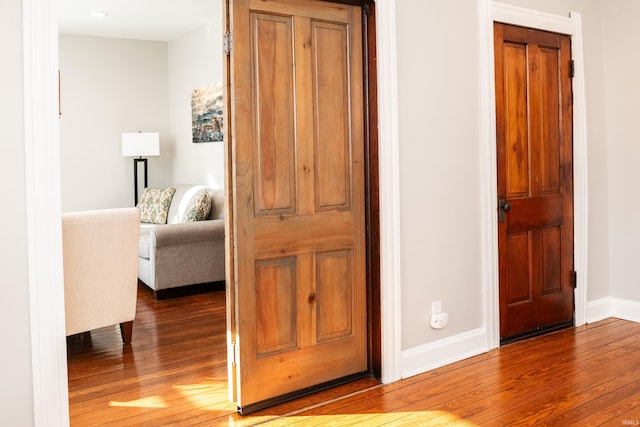 corridor featuring hardwood / wood-style floors