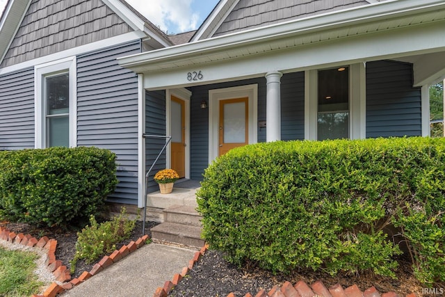 entrance to property featuring covered porch