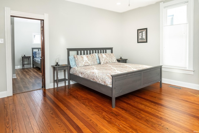 bedroom with hardwood / wood-style floors