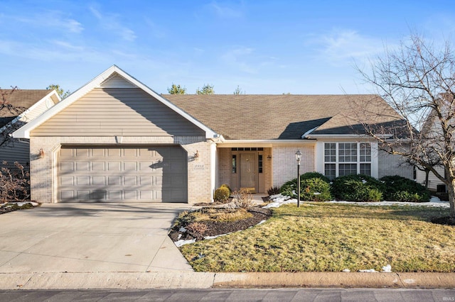 ranch-style house with a garage and a front lawn