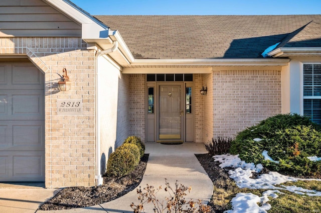 doorway to property featuring a garage