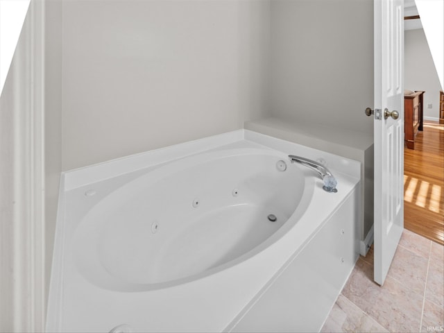 bathroom featuring a tub to relax in