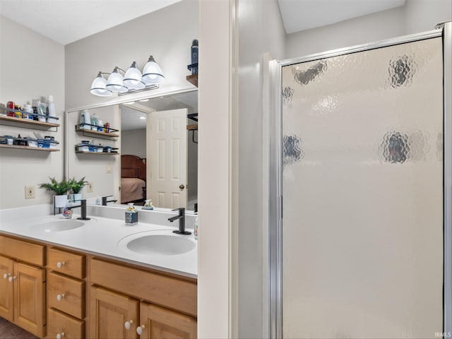 bathroom featuring vanity and a shower with shower door