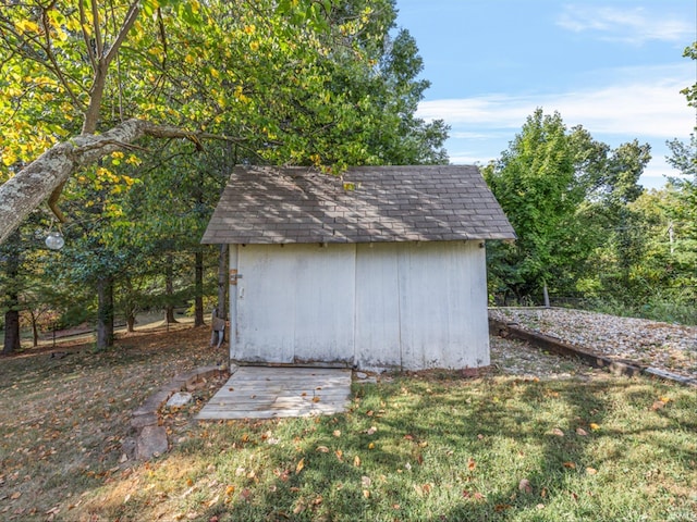 view of outbuilding with a lawn