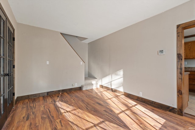 unfurnished living room featuring hardwood / wood-style floors