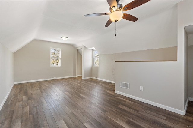 bonus room with dark wood-type flooring, ceiling fan, and lofted ceiling