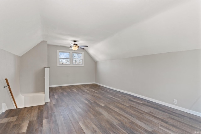 additional living space featuring dark hardwood / wood-style flooring and lofted ceiling