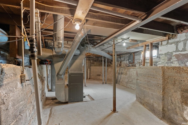 basement with electric panel and heating unit