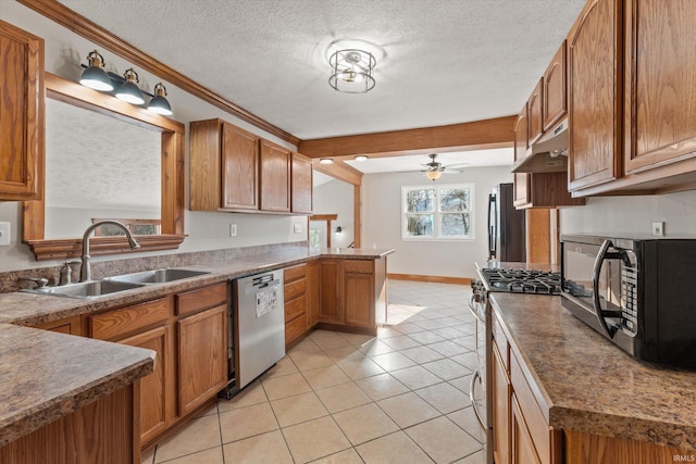 kitchen with appliances with stainless steel finishes, sink, light tile patterned floors, ceiling fan, and kitchen peninsula