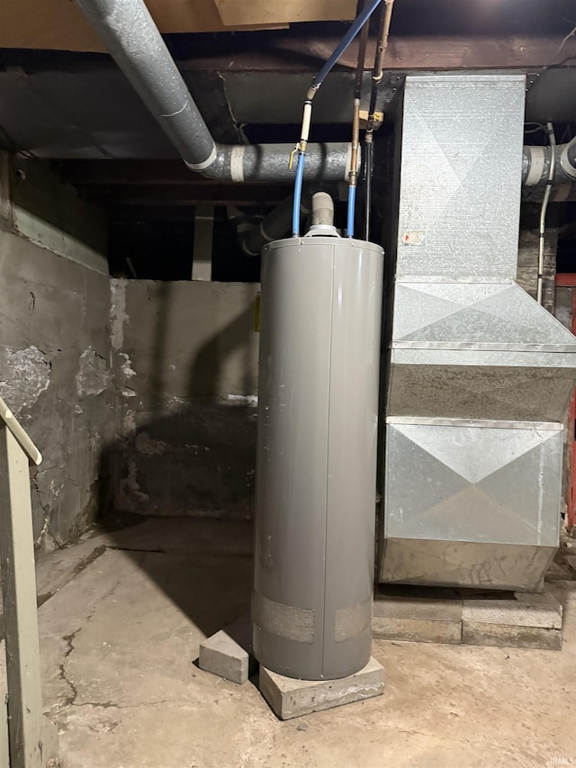 utility room featuring water heater