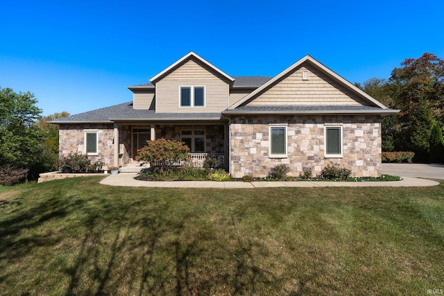 craftsman-style home featuring a porch and a front lawn