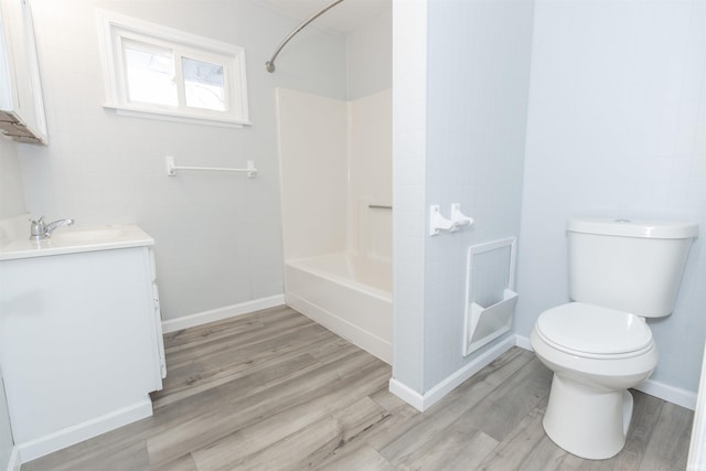 full bathroom featuring toilet, vanity, shower / washtub combination, and wood-type flooring