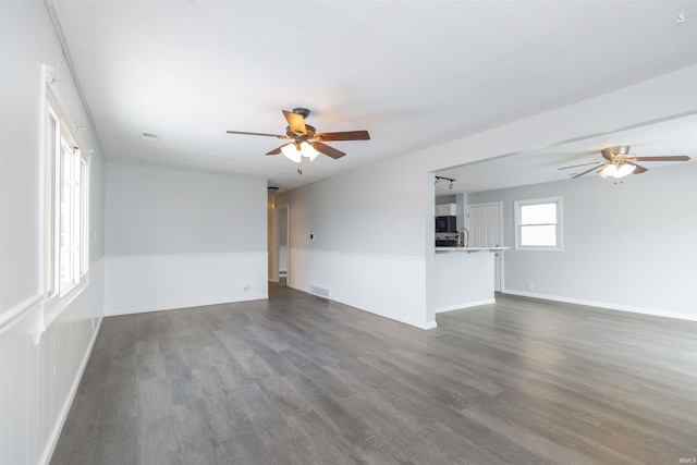 interior space with dark hardwood / wood-style floors and ceiling fan