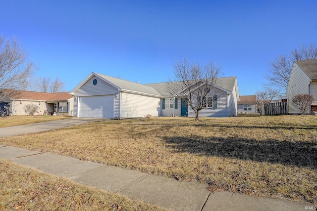 ranch-style home with a garage and a front lawn