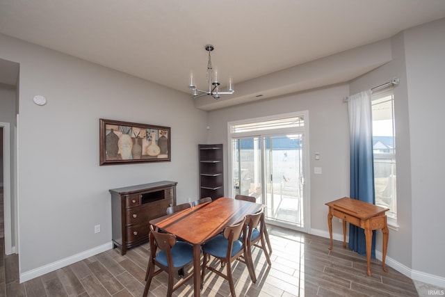 dining space featuring a notable chandelier