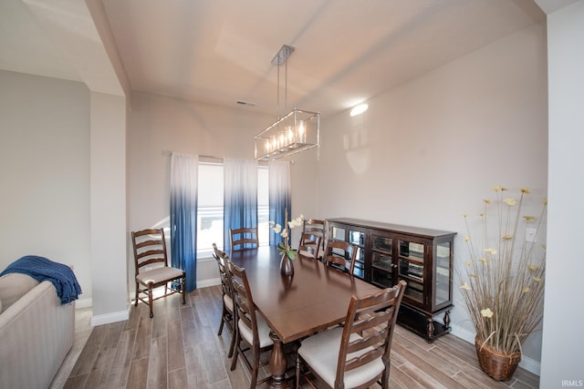 dining room with a notable chandelier