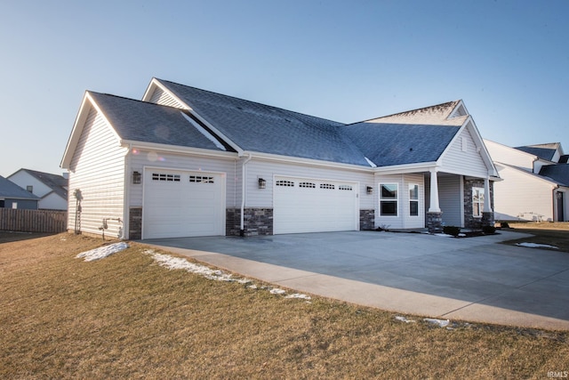 view of front facade with a garage and a front lawn